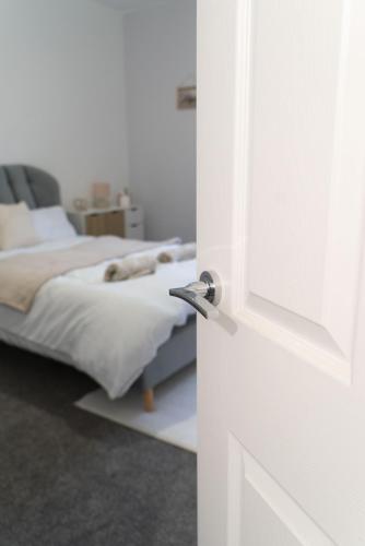 an open door to a bedroom with a bed at Harrison Hideaway in Carlisle