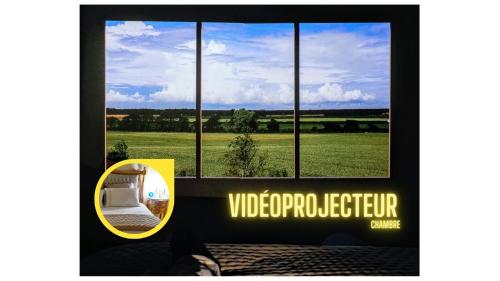 a picture of a window with a view of a field at Boudoir de la Sagesse in Périgueux