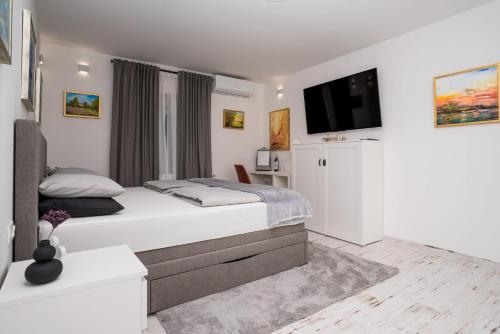 Postel nebo postele na pokoji v ubytování Bogdanović Winery Apartman