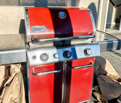 a red stove sitting on top of a table at Luxe At Louise in Tacoma