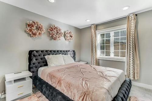 a bedroom with a bed and a window at Luxe At Louise in Tacoma