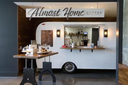 an almost home coffee truck with a table in front of it at Chique Loft 15 Min from NYC with City View & Pool in Jersey City