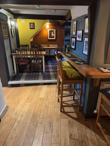 a kitchen and dining room with a table and chairs at Masons Arms in Montacute