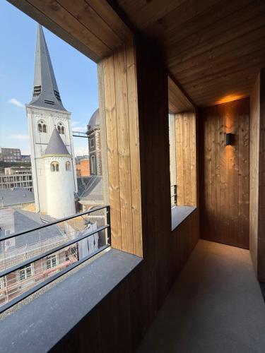 a balcony with a view of a church at Getaway Studios Liège in Liège
