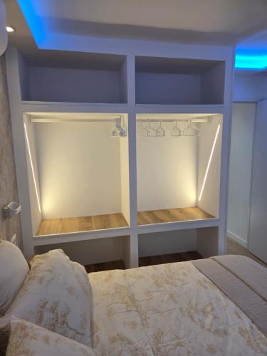 a bedroom with a closet with a bed in it at Luxury Alondras E108 in Arona