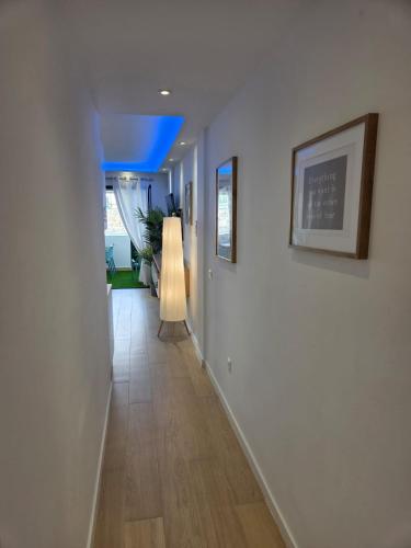 a hallway with white walls and a blue ceiling at Luxury Alondras E108 in Arona