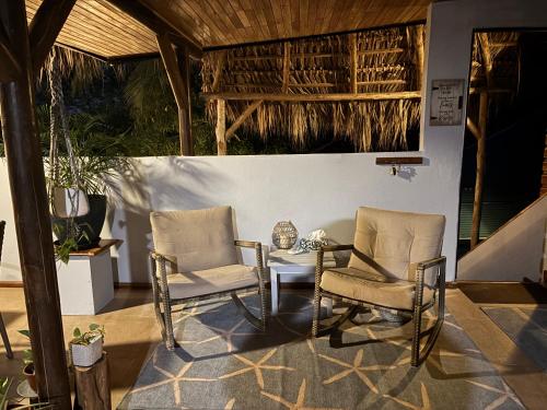 two chairs and a table on a patio at Quinta Esencia in Brasilito