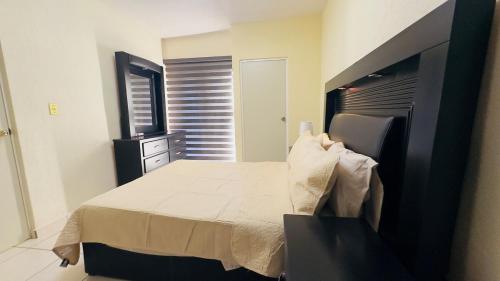 Cama o camas de una habitación en Casa California de una planta