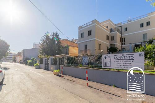 an empty street with a sign in front of a building at Al Convento Bed & Breakfast Vasto Marina in Vasto