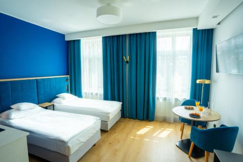 SQUARE APARTMENTS GDYNIAにあるベッド
