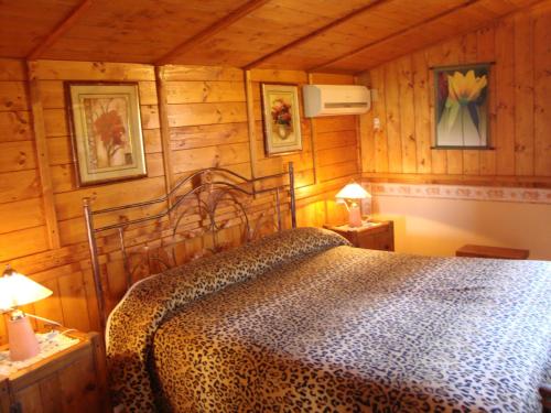 Ένα ή περισσότερα κρεβάτια σε δωμάτιο στο La Casetta Dei Sogni D'Oro