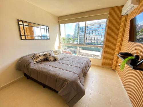 a bedroom with a bed with a teddy bear on it at Espacio Arena in Buenos Aires