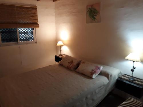 En eller flere senge i et værelse på Descanso