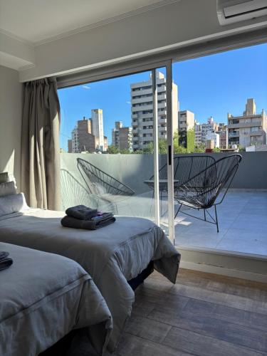 Uma cama ou camas num quarto em Av Suites