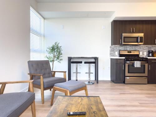 a living room with a couch and a table at Studio Suite - 5 Min Walk to Crypto Arena and Convention Center in Los Angeles