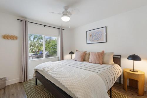 a bedroom with a large bed and a window at The Stylish Cozy Bungalow in North Park in San Diego