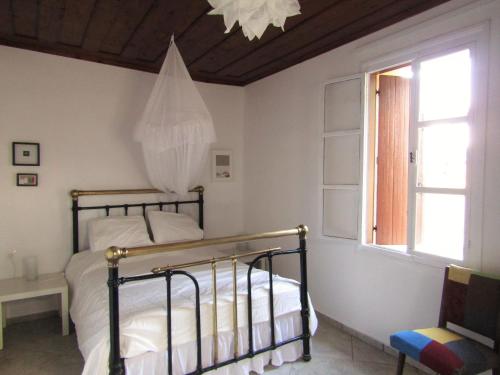 Ένα ή περισσότερα κρεβάτια σε δωμάτιο στο Trouli House