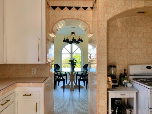 a kitchen with a table and a dining room at SpanishFairytale4bd3ba in San Pedro