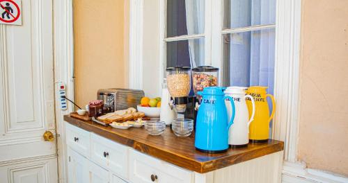 a counter with a bunch of items on it at La Galería B&B in Valparaíso