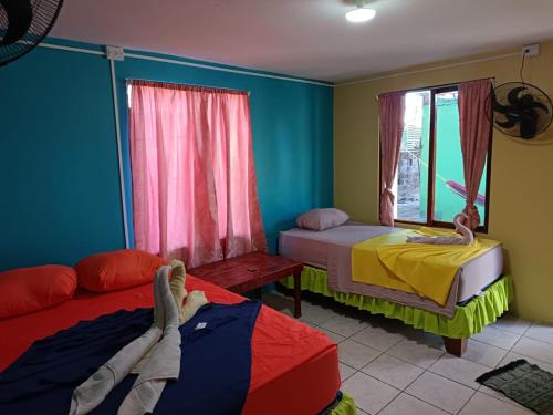 Postel nebo postele na pokoji v ubytování Cabinas Miss Miriam 2