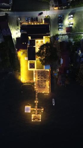 an overhead view of a building with lights at night at Damar Toba in Balige