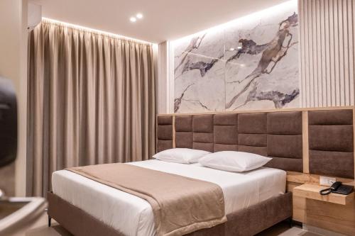 Postel nebo postele na pokoji v ubytování Koko Hotel