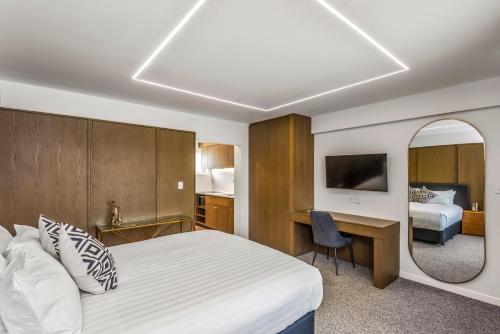 Ένα ή περισσότερα κρεβάτια σε δωμάτιο στο Poenamo Hotel