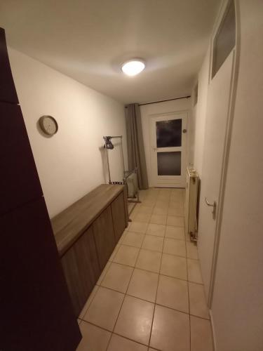 a hallway of a bathroom with a tub and a window at Ap78 Nature Ardennes Economy class apartment in La Calamine