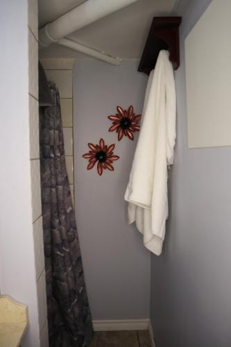 a bathroom with a towel hanging on a wall at Calgary's Home Cinema Retreat in Calgary