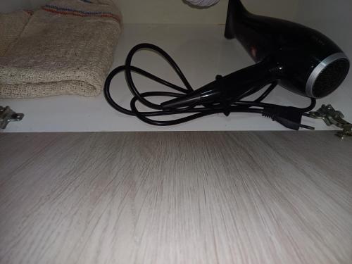 a hair dryer sitting on the floor in a room at Tranquilo in Fray Bentos