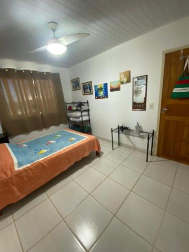 a bedroom with a bed in a room at Recanto Santa Helena Iriri Santa Helena in Anchieta