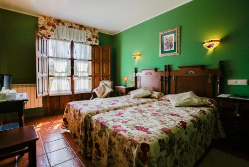 
a bedroom with a large bed and a large window at Hotel Camangu in Camango
