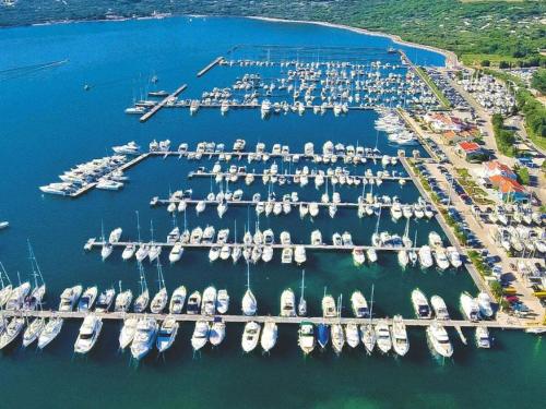 an aerial view of a marina with boats in the water at Holiday apartment in Punat with swimming pool in Punat