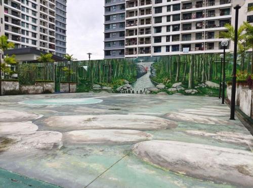 a painting of a courtyard in a city with buildings at The Garden 6Pax Comfort Convenient Stay BySTAY in Johor Bahru