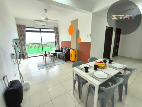a living room with a table and chairs at The Garden 6Pax Comfort Convenient Stay BySTAY in Johor Bahru