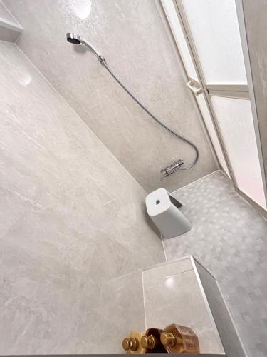 a bathroom with a shower with a glass table at Y-Shinjuku City, Okubo 5F-SJ0070 in Tokyo