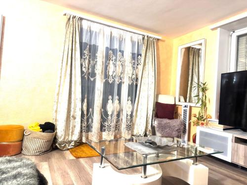 Телевизор и/или развлекательный центр в Bahnhof West Apartments