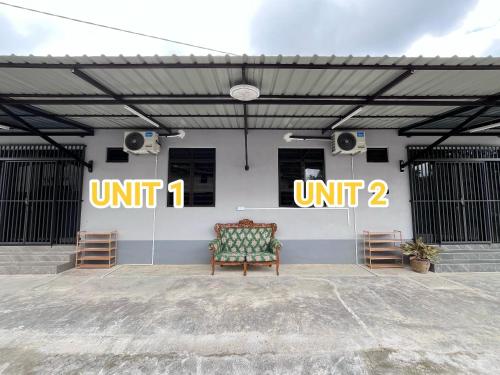 a room with a bench and speakers in a building at AF Barokah Homestay Unit 2 , Kuala Terengganu in Kuala Terengganu