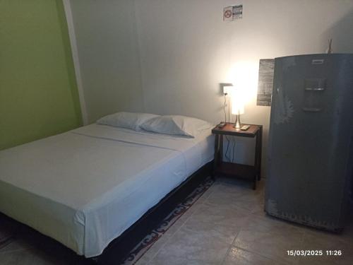 Postel nebo postele na pokoji v ubytování La fantástica Mi Hostal