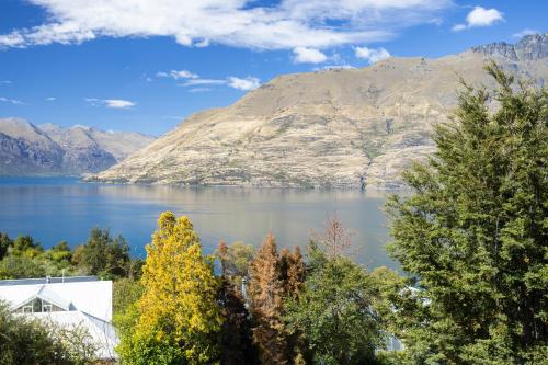 a view of a lake with mountains in the background at Spectacular LAKE View in Queenstown
