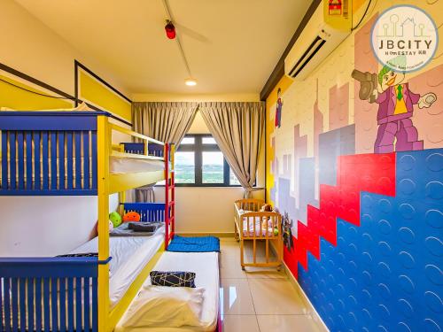 a bedroom with bunk beds and a mural at Pangsapuri Meridian by RR JBcity in Nusajaya