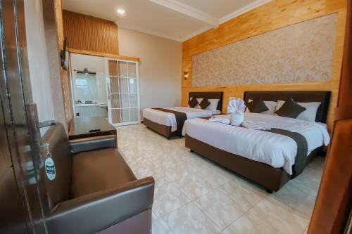 Postel nebo postele na pokoji v ubytování Parama Bromo Hotel