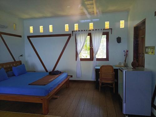 Postel nebo postele na pokoji v ubytování Prince John Dive Resort