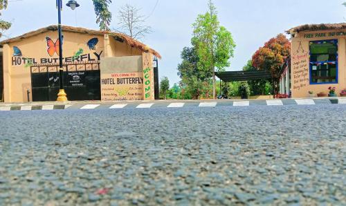 an empty street in front of a building at Hotel Butterfly - Peaceful Garden for Nature Lovers in Sauraha