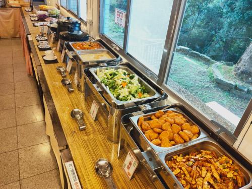 a buffet line with many different types of food at 復興青年活動中心 復興比雅山會館 in Fuxing