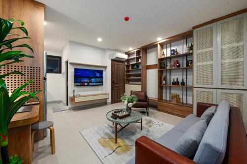 a living room with a couch and a table at The Literature'N Central Hotel and Travel Ha Noi 177 in Hanoi