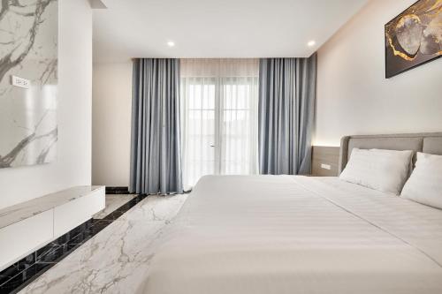 Кровать или кровати в номере Elyday Villa - Bai Khem Beach, Phu Quoc