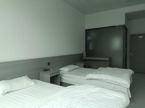 Postel nebo postele na pokoji v ubytování Heleju Homestay