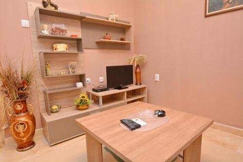 a room with a desk with a computer on it at Marinero Apartments in Kotor
