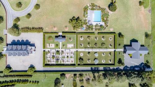 an aerial view of a house with a garden at Linnaeus Farm, Berry - by Linnaeus Collection in Berry